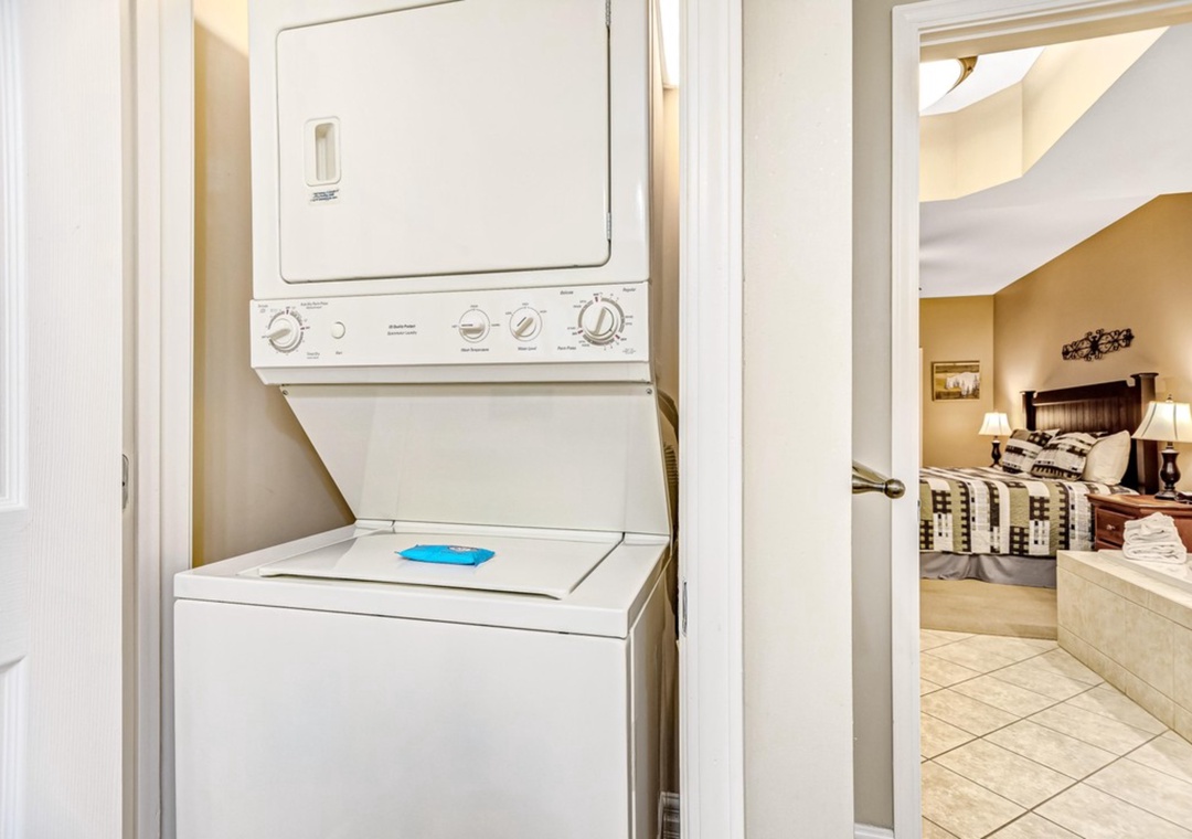 Keep your wardrobe fresh with your own private washer and dryer, tucked conveniently in the hallway for easy access.