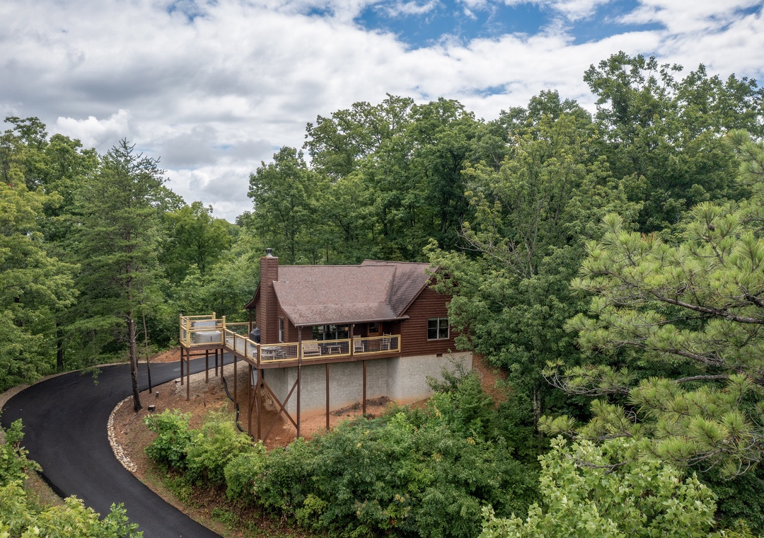 Nestled among towering trees, this secluded mountain cabin offers peaceful privacy with a spacious wraparound deck, newly paved driveway, and stunning natural surroundings.