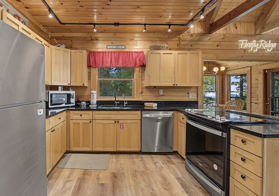Your fully-equipped mountain kitchen makes meal prep a breeze, with gleaming stainless appliances and warm wood surroundings that blend rustic charm with modern convenience.
