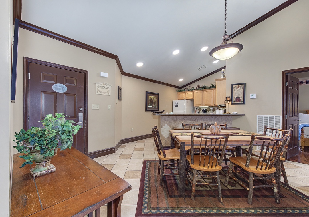 Gather around your spacious dining table for memorable meals, with a fully equipped kitchen just steps away for home-cooked comfort.