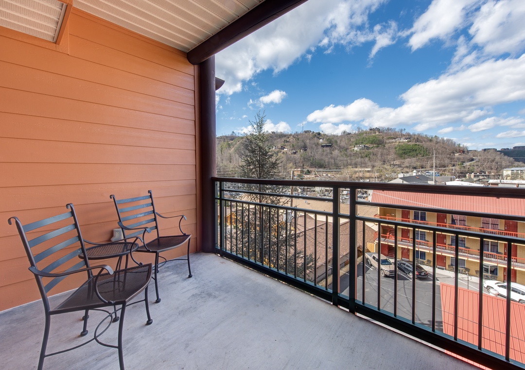 Step onto your private balcony and soak in sweeping mountain views while enjoying morning coffee in comfortable outdoor seating.