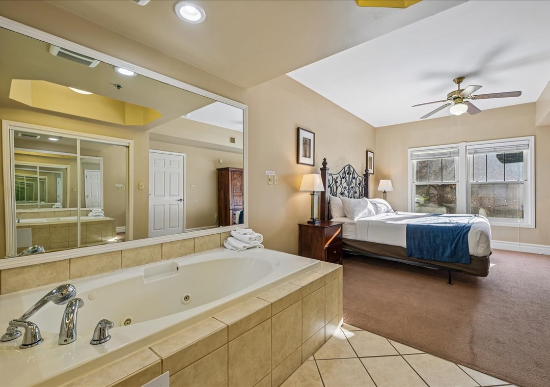 Unwind in your luxury suite featuring a jetted tub steps from your bed—pure relaxation awaits.