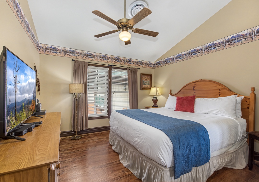 Sink into crisp linens and drift off peacefully beneath your private ceiling fan in this cozy bedroom retreat.