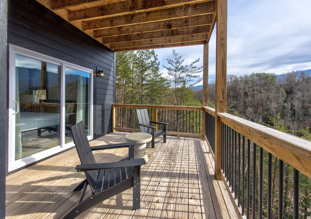 Your private deck overlooks forested hills, offering peaceful mountain views where you can unwind with morning coffee or evening relaxation.