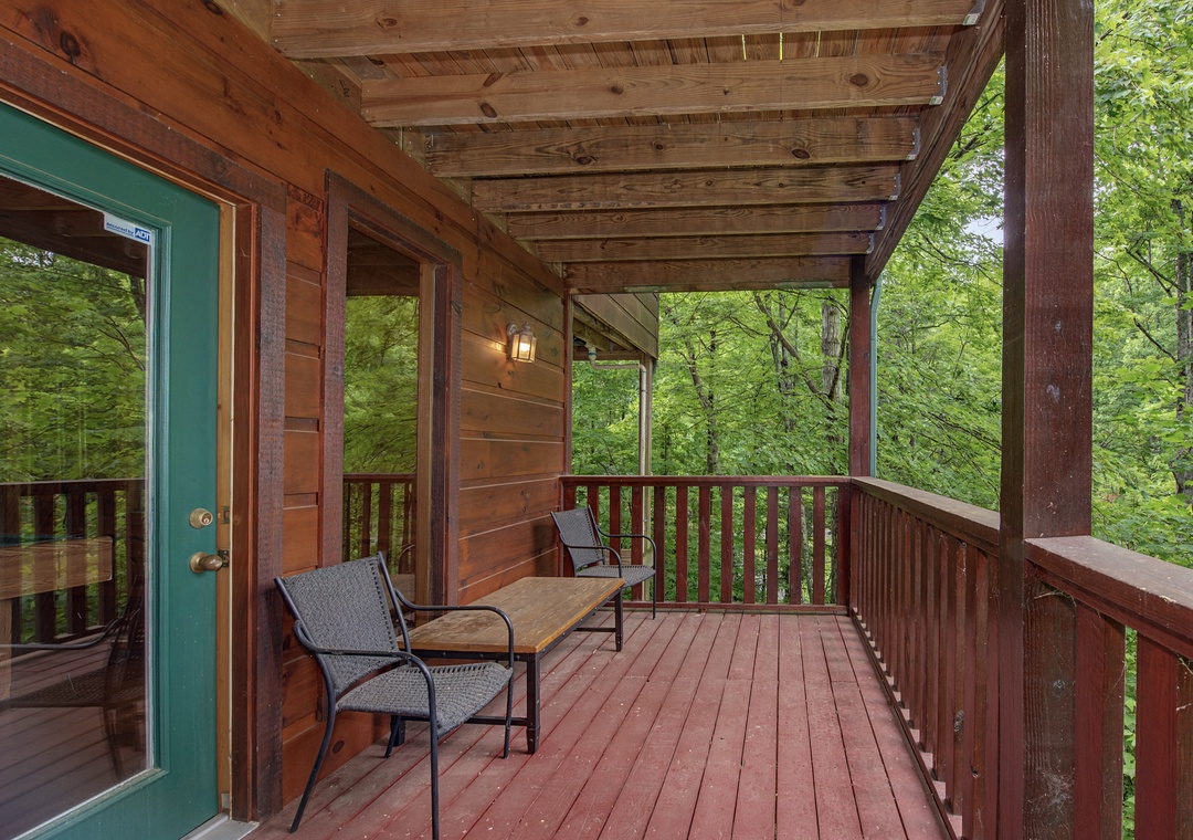 Relax on your private covered deck surrounded by towering trees. Sip morning coffee at the table or unwind in wicker chairs while forest sounds drift through the canopy.