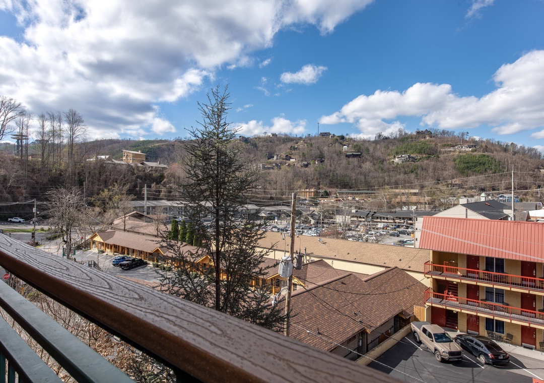 Mountain town views stretch across rolling hills dotted with homes and local buildings in this scenic area.