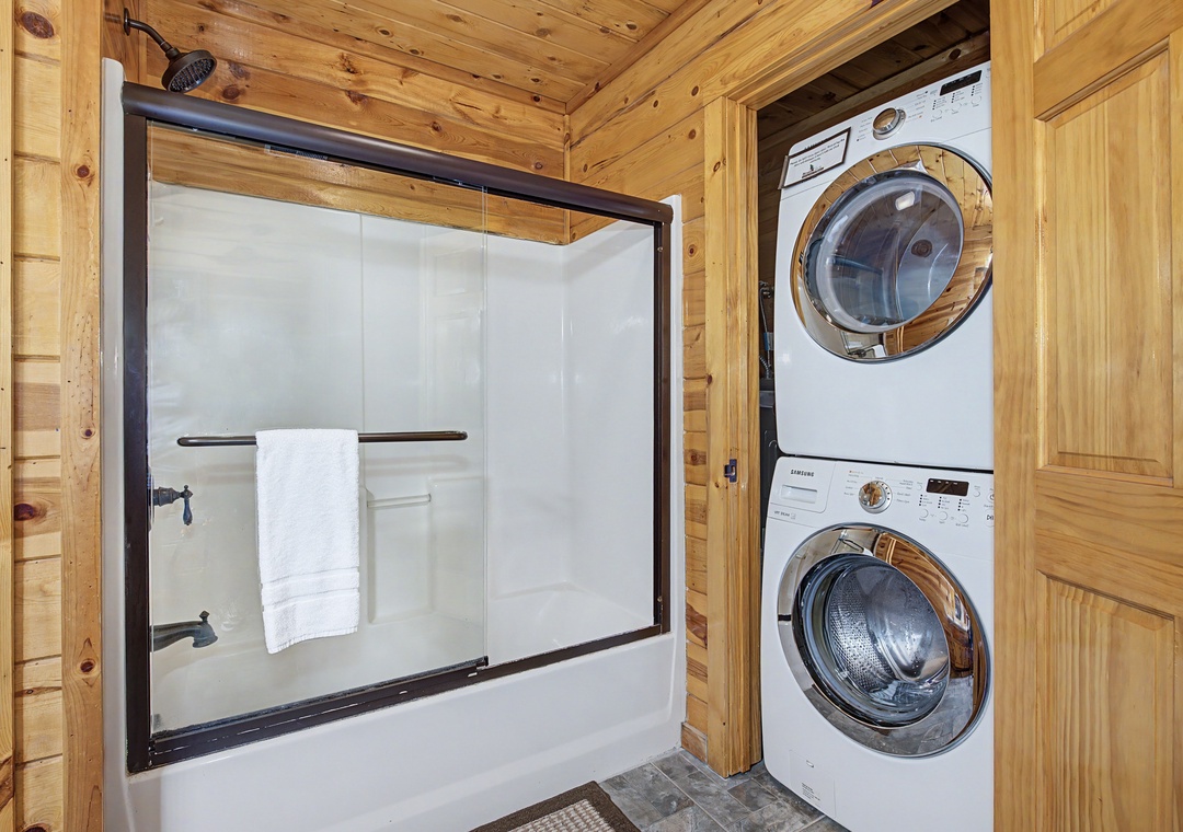 Freshen up in your private shower and toss your clothes in the stacked washer-dryer—convenience and comfort, all in one cozy corner of your cabin retreat.