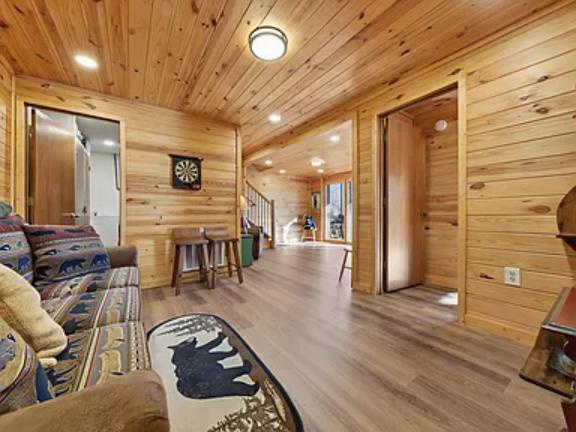 Step into your cozy mountain retreat with warm wood walls and vaulted ceilings. Settle into the plush seating after a day of adventure, or challenge friends to darts by the inviting wood stove.