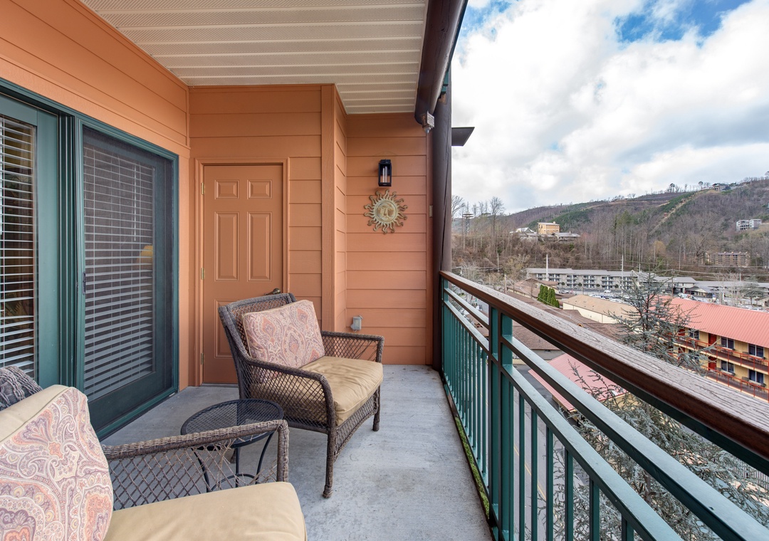 Step onto your private balcony to unwind in comfortable seating while enjoying mountain views and fresh air.