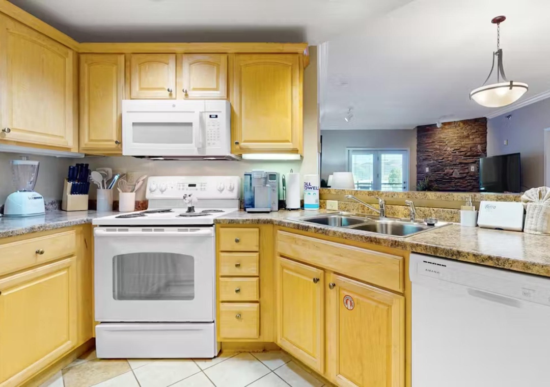 Cook your favorite meals in this fully equipped kitchen featuring granite counters, stainless appliances, and everything you need for a comfortable stay.
