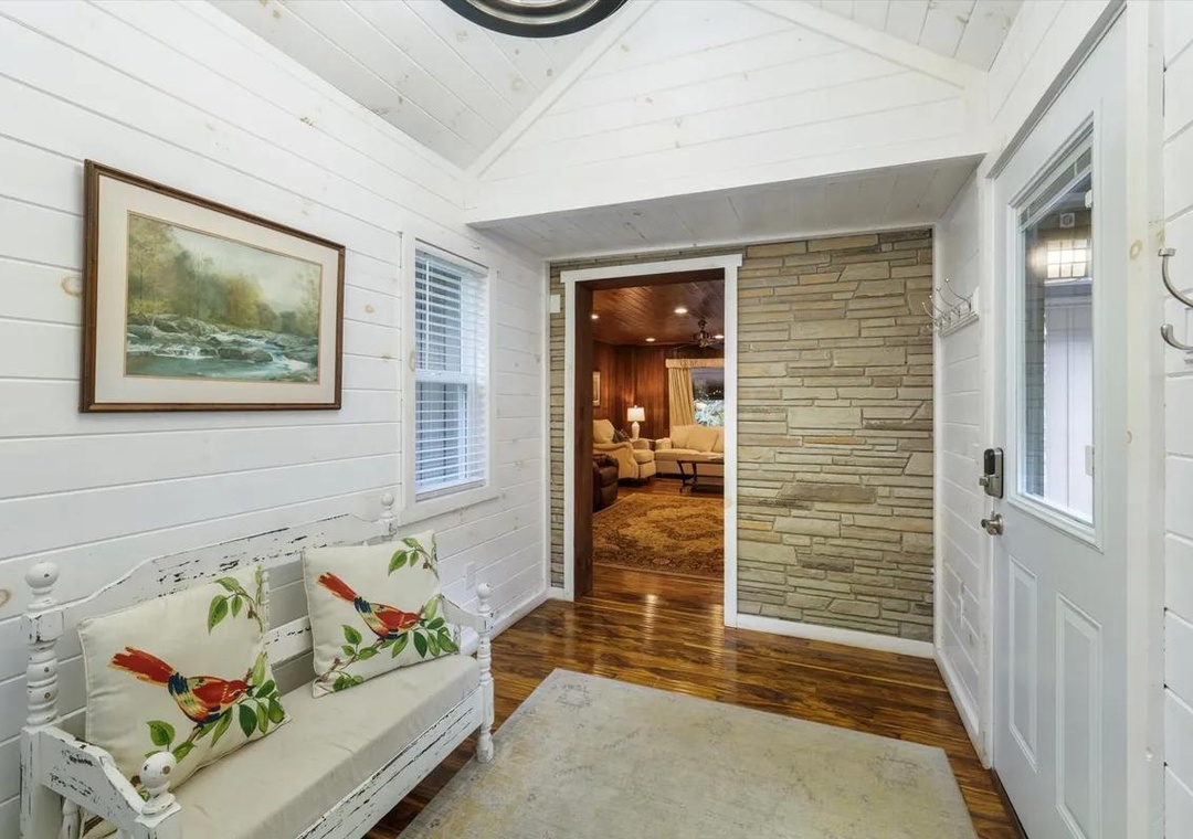 Step into your private retreat through this charming entryway, where rustic stone and warm wood floors welcome you home after each day's adventures.