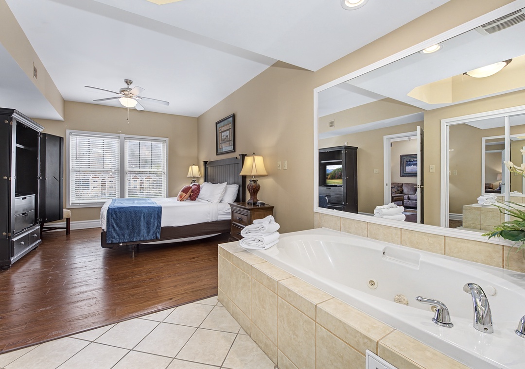 Unwind in your spacious bedroom featuring a luxurious jetted tub, perfect for romantic evenings after exploring the area.