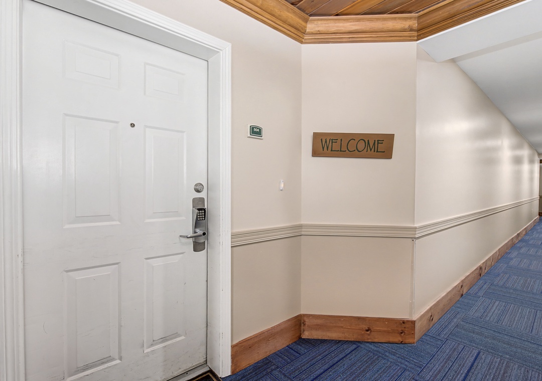 Step into your home away from home with a warm welcome greeting you at your door. The elegant hallway sets the tone for your comfortable stay.