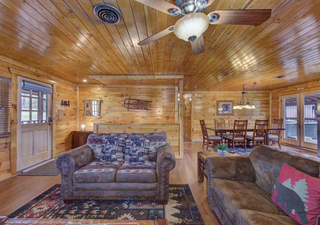 Relax in your cozy log cabin living room with rustic charm, comfortable seating, and an open layout perfect for gathering.