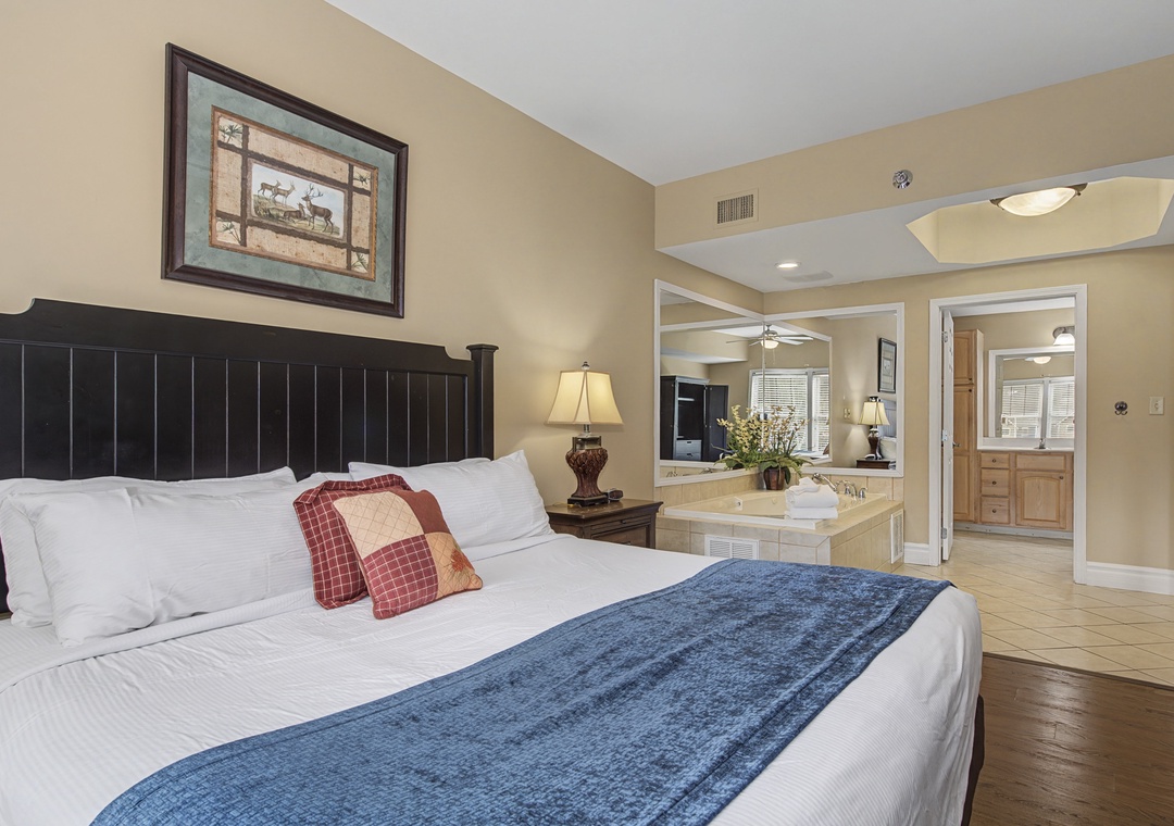 Your spacious suite features a king bed with luxurious linens, plus an indulgent whirlpool tub for romantic evenings.