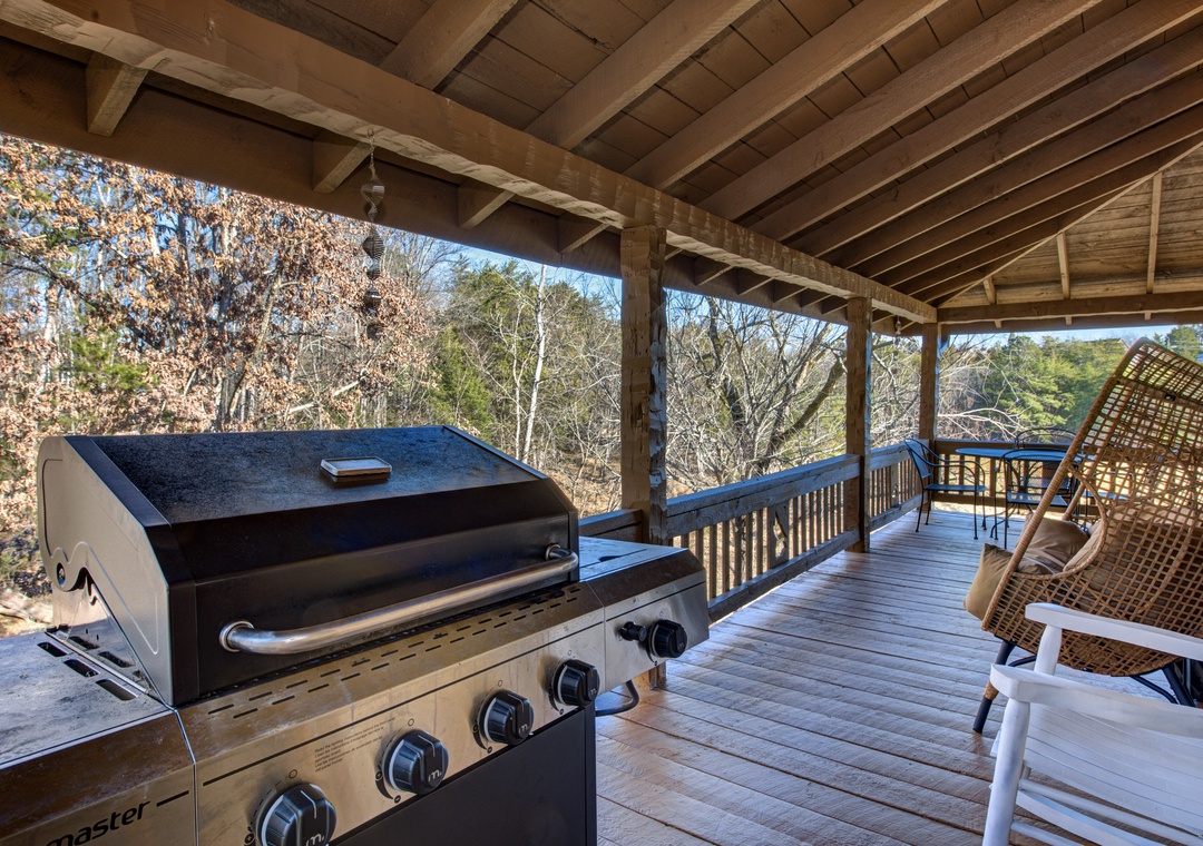 Relax in your wicker chair on this covered deck while your meal sizzles on the BBQ, surrounded by peaceful forest views.