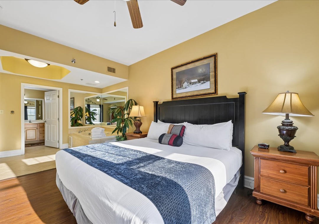 Unwind in your elegant bedroom featuring rich wood beams, plush bedding, and warm lighting that creates the perfect retreat.