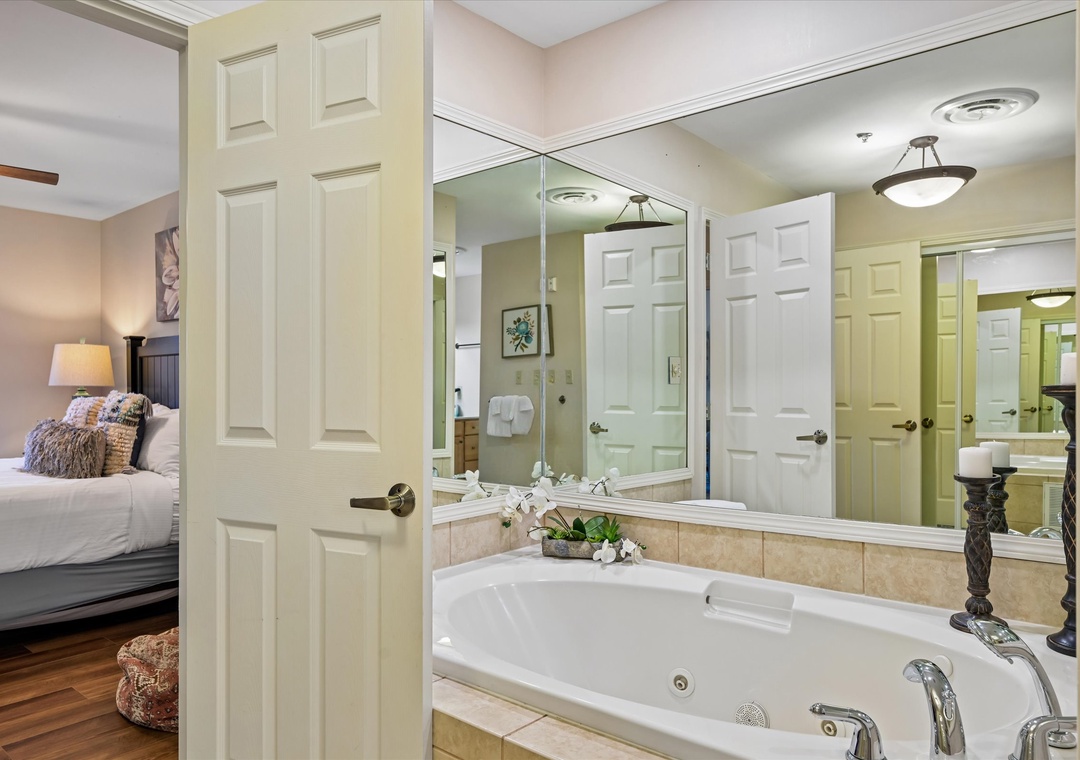 Unwind in your spa-like suite featuring a luxurious soaking tub and elegant bedroom retreat.