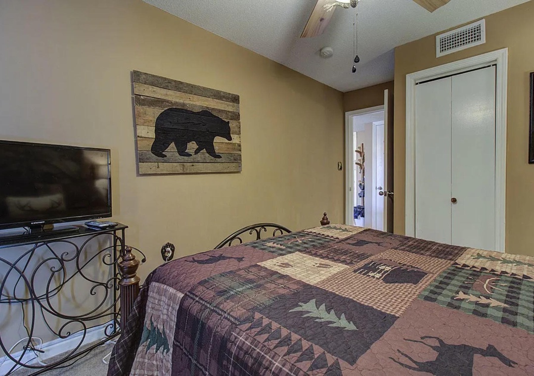 Cozy up in your rustic retreat with lodge-inspired decor, a comfy bed, and your own TV for peaceful evenings.