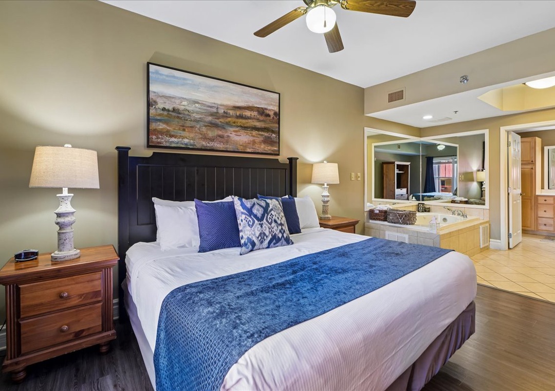 Drift off in this plush king bed with ceiling fan overhead, while your spa-like jetted tub awaits just steps away.
