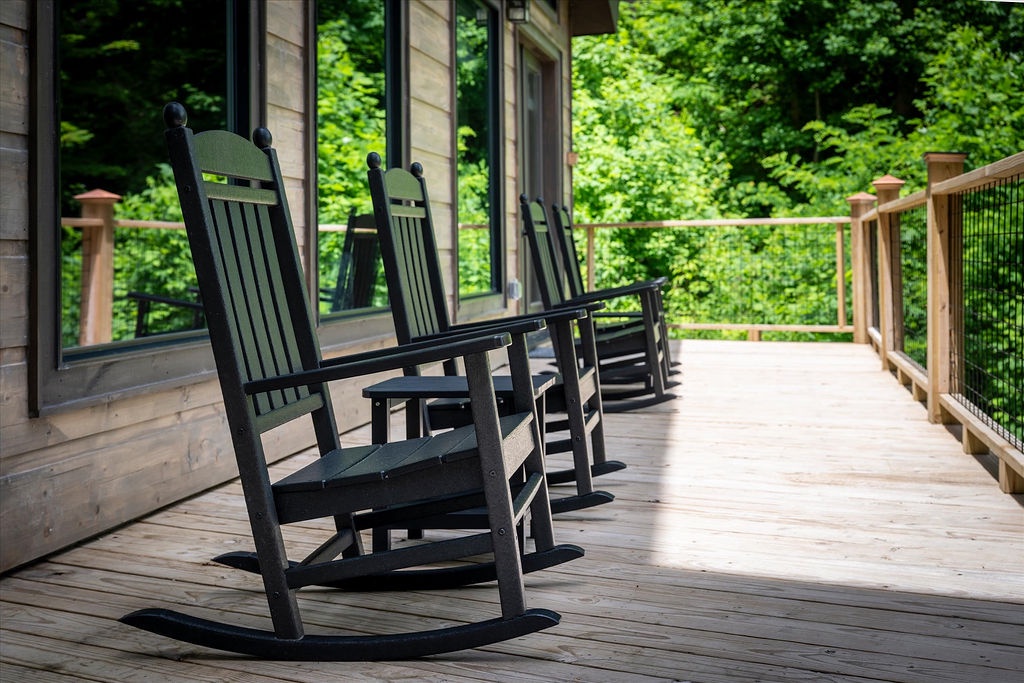 Picture yourself gently rocking in these classic chairs, sipping morning coffee as you gaze out at lush forest views. Your private deck becomes the perfect peaceful retreat.