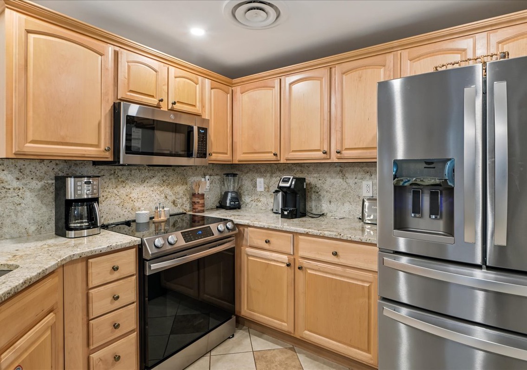 Your fully-equipped kitchen awaits with granite counters, stainless appliances, and everything you need to create delicious meals together.