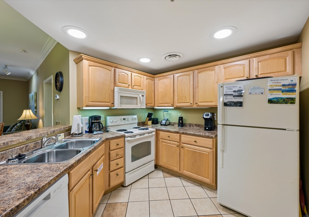 Your fully equipped kitchen awaits with granite countertops, coffee maker, and everything needed to prepare meals during your stay.