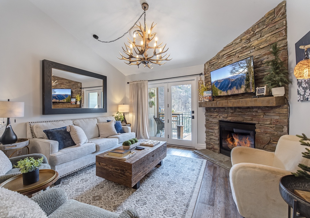 Unwind in your elegant mountain retreat with a crackling fireplace, rustic charm, and stunning alpine views from your private balcony.