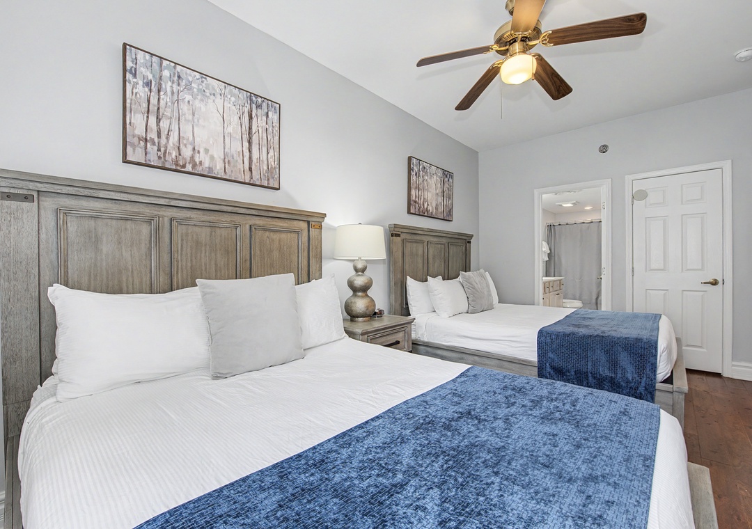 Sink into crisp white linens and enjoy your peaceful retreat in this beautifully appointed bedroom with rustic charm and modern comfort.