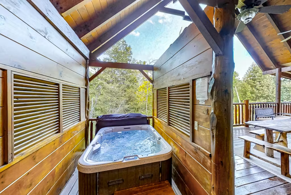 Soak in your private hot tub beneath soaring timber beams and skylights, where forest views create the perfect sanctuary.