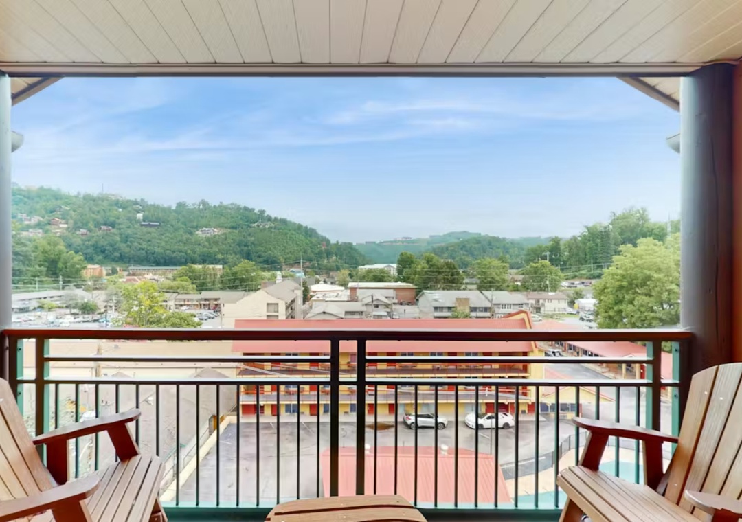 Unwind on your private balcony with sweeping mountain views and comfortable seating, perfect for morning coffee or evening relaxation.