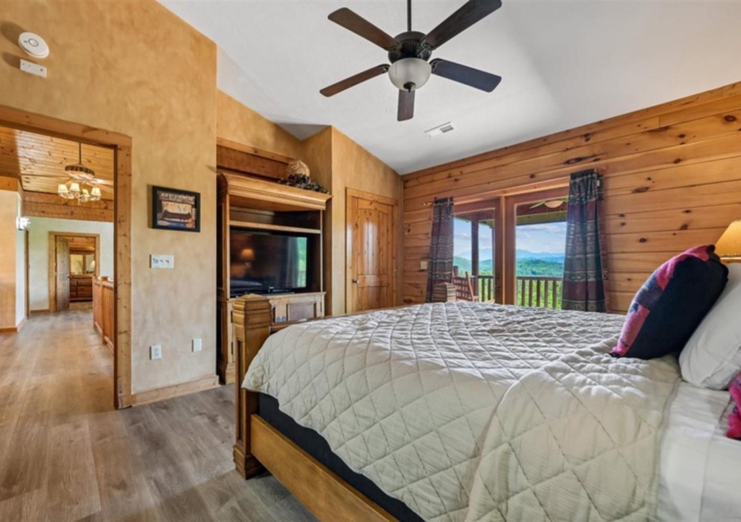 Wake up to mountain views framed by your private balcony, where fresh air and peaceful scenery greet you each morning in this cozy retreat.