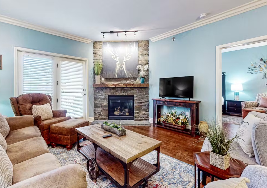 Sink into plush leather seating by your cozy stone fireplace, where soft lighting and thoughtful touches create the perfect retreat for relaxation.