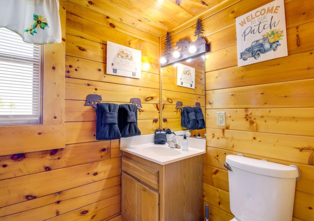 Freshen up in your cozy log cabin bathroom with rustic charm and modern convenience.