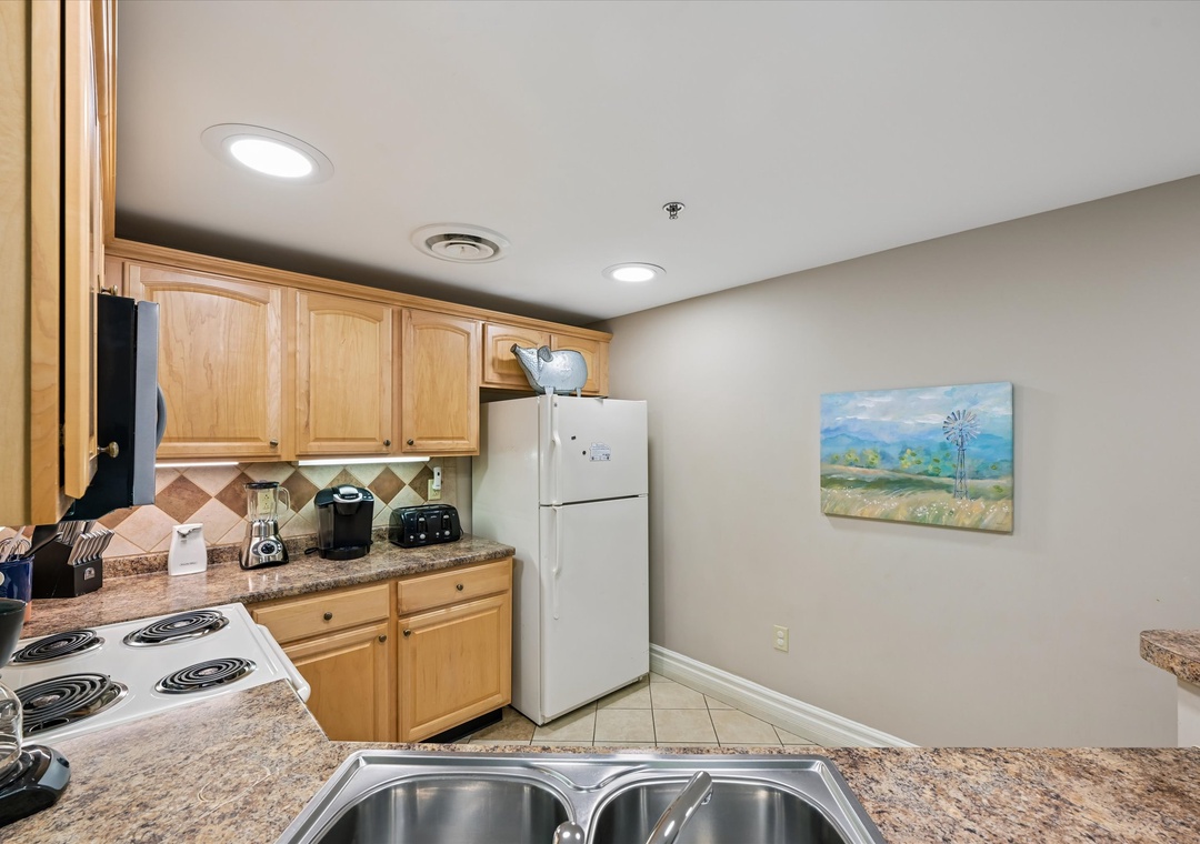 Cook your favorite meals in this fully equipped kitchen with granite counters, modern appliances, and everything you need for a comfortable stay.