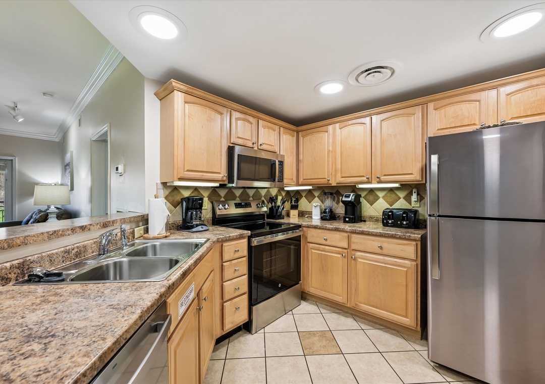 Your fully equipped kitchen awaits with granite countertops, stainless steel appliances, and all the essentials for memorable meals.