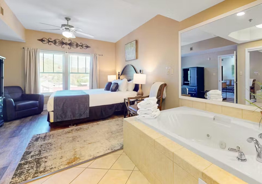 Unwind in your spacious suite featuring a king bed and luxurious jetted tub, perfect for romantic evenings after exploring the area.