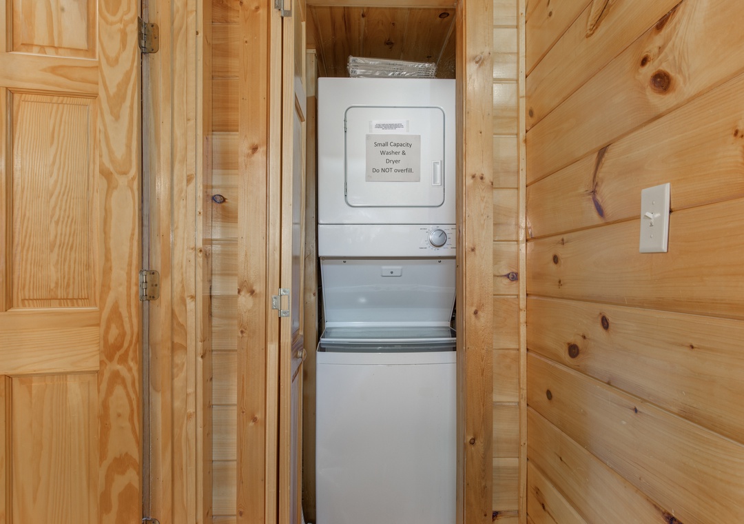 Your in-unit washer and dryer make extended stays effortless, nestled in warm wood surroundings for convenience.