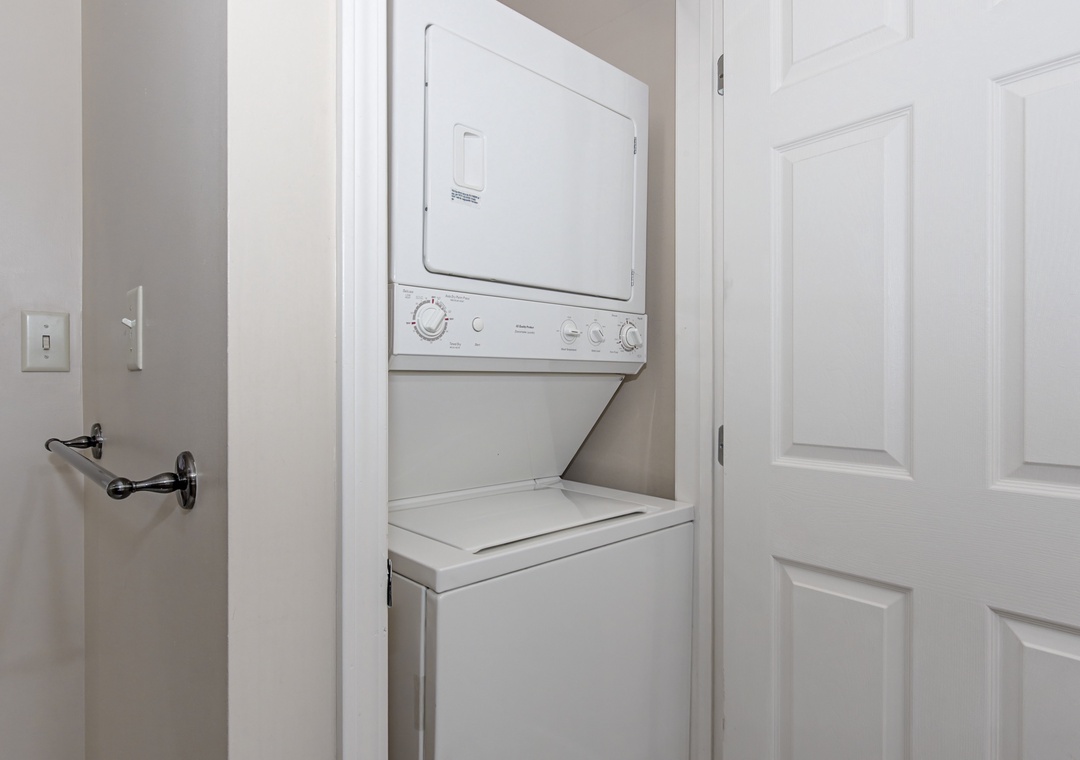 Keep your vacation wardrobe fresh with your own convenient in-unit washer and dryer, tucked away in a sleek closet for easy access.