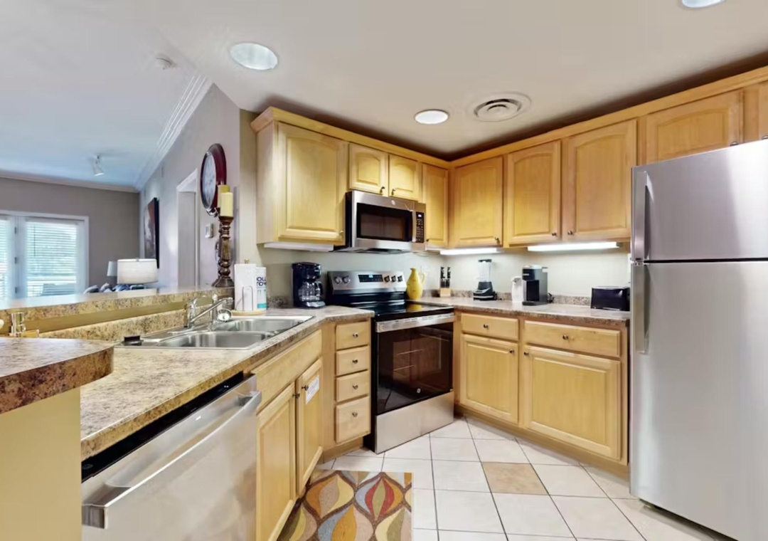 Your fully equipped kitchen awaits with granite counters, stainless appliances, and everything needed for home-cooked meals during your stay.