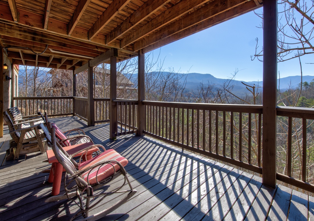 Unwind on your private deck with sweeping mountain views, where comfortable chairs await your morning coffee or evening relaxation.