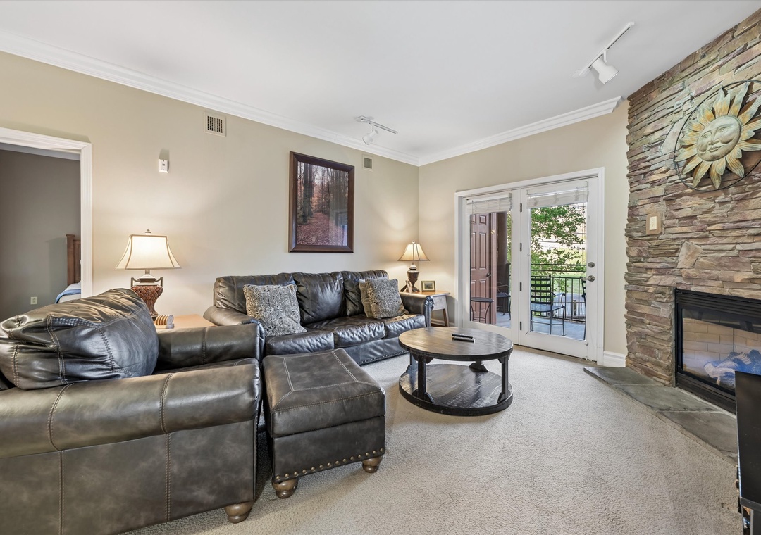 Sink into plush leather seating by your stone fireplace, where warm lighting creates the perfect atmosphere for relaxation after your adventures.