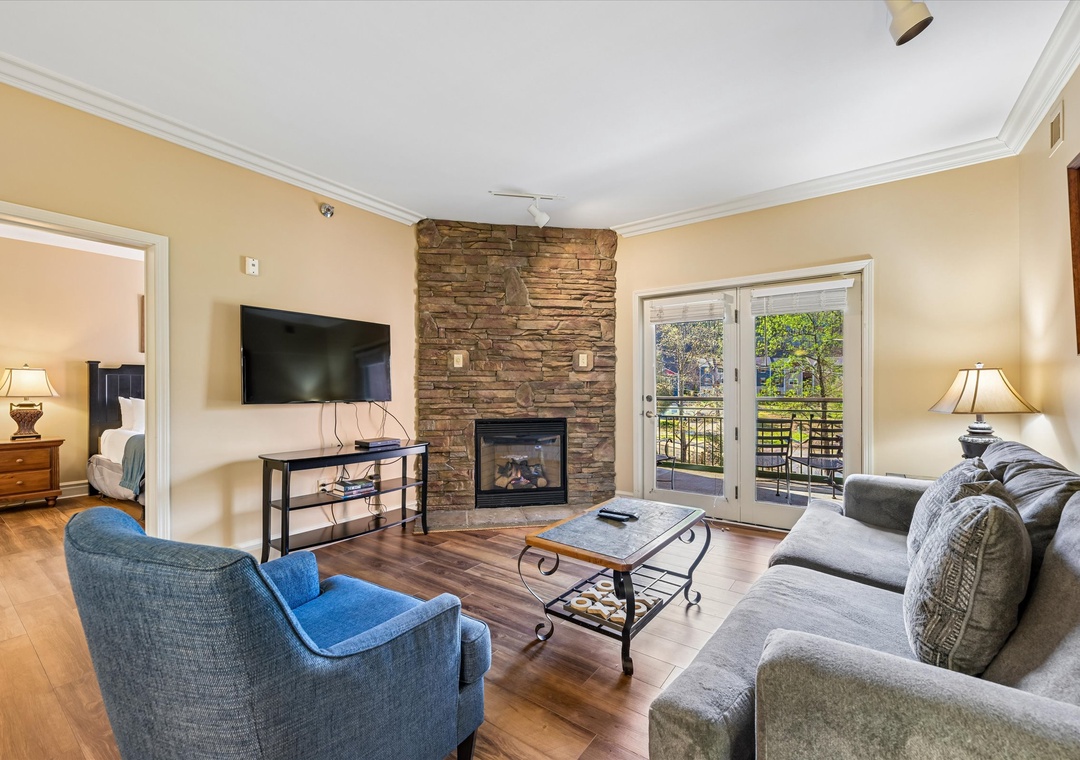 Cozy up by your stone fireplace while watching TV or step onto your private balcony to enjoy garden views.