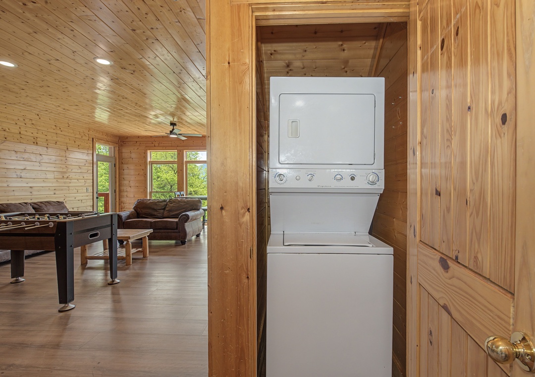 Your in-unit washer and dryer tucked neatly into custom wooden cabinetry means fresh clothes throughout your stay.
