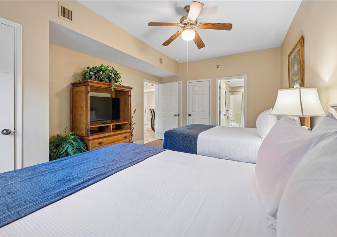 Settle into your serene bedroom retreat with plush bedding and warm wood touches creating the perfect space for restful nights.