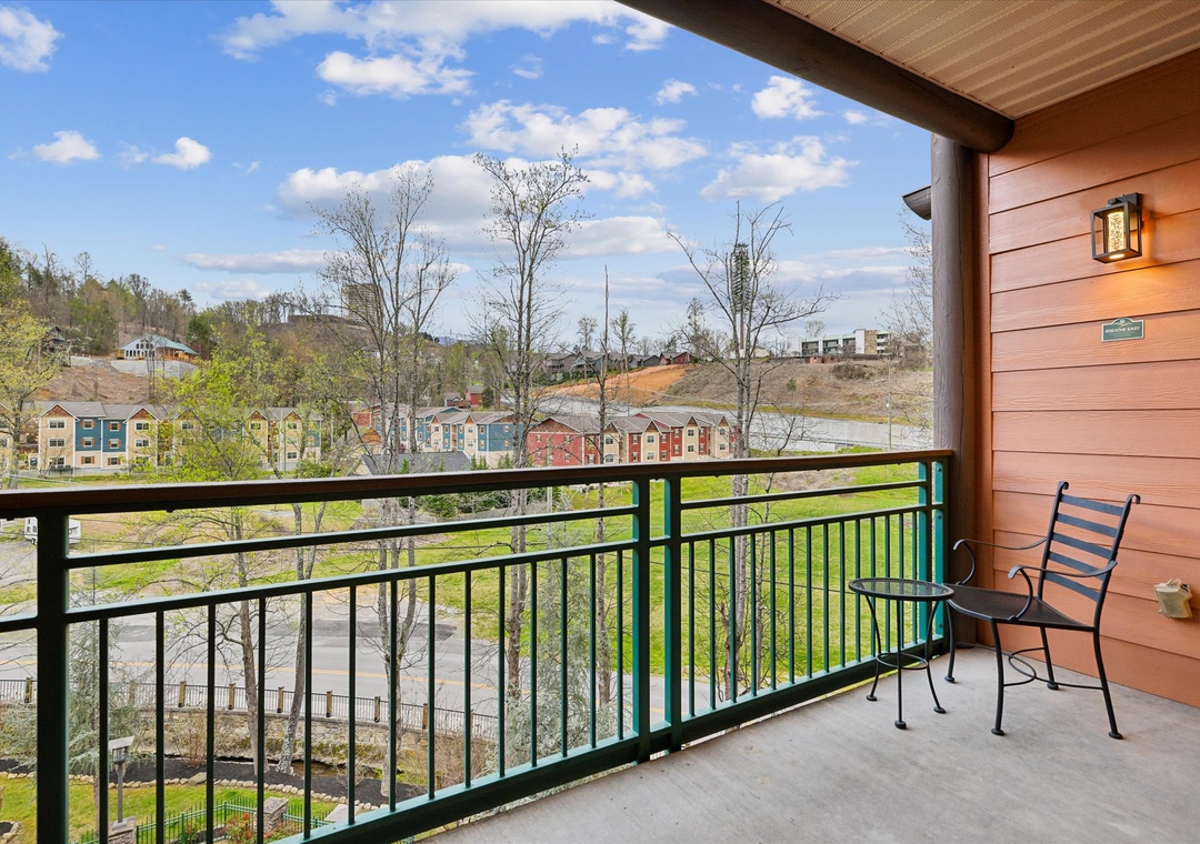Step onto your private balcony and enjoy sweeping views of the charming neighborhood below, perfect for morning coffee or evening relaxation.