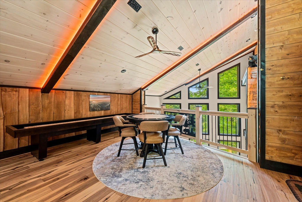 Gather around the game table in your lofted retreat, where soaring ceilings and panoramic forest views create the perfect setting for friendly competition and laughter.