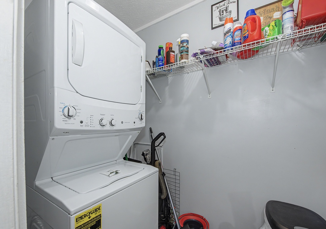 Your private laundry room keeps you organized with a stackable washer-dryer and convenient storage shelves for all your essentials.