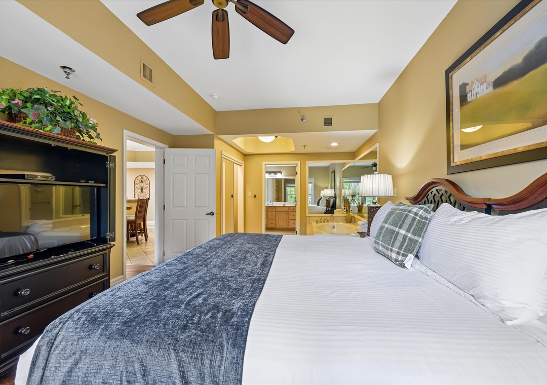 Unwind in your spacious master bedroom with plush bedding, fireplace, and luxurious en-suite featuring a soaking tub.