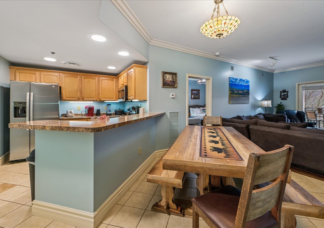 Unwind in your spacious open-plan living space where the kitchen flows seamlessly into the cozy lounge area, perfect for gathering.